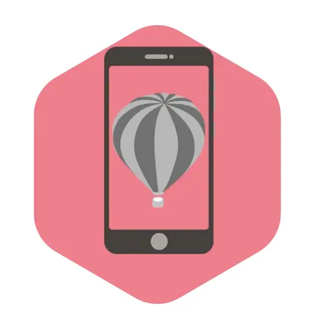 Ein Smartphone zeigt einen aufsteigenden Heißluftballon in Grautönen. Der Hintergrund ist rosa. Das Bild symbolisiert möglicherweise das Entdecken neuer Höhen oder Abenteuer durch digitale Mittel.