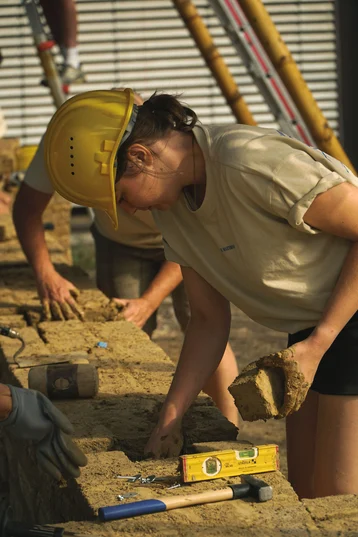 A student works on clay blocks