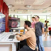 People working in an engineering lab at HSRM
