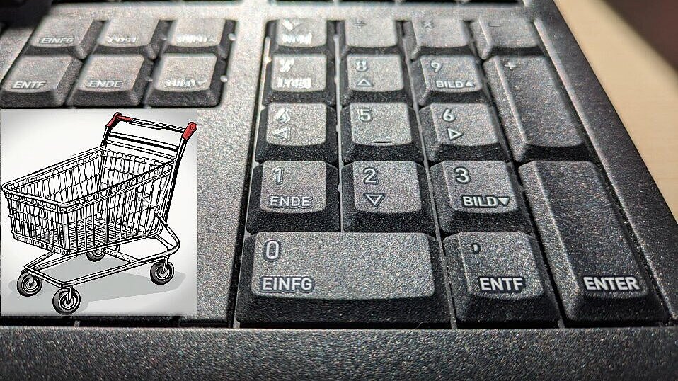Einkaufswagen links von einem Tastatur Nummernblock