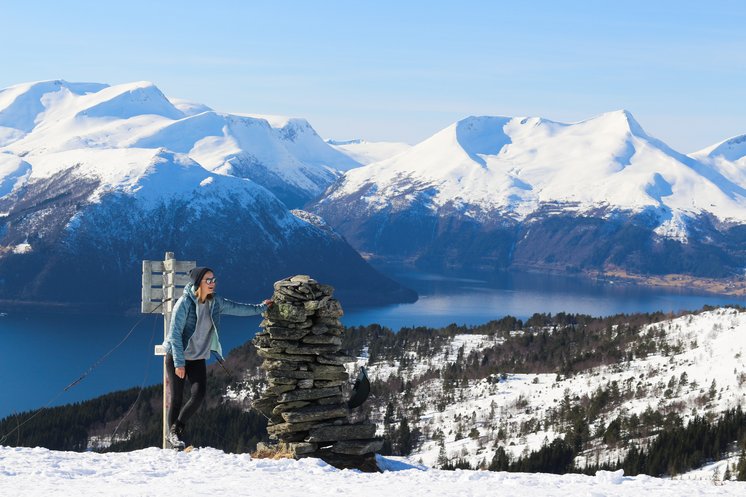 Image shows a student on a mountain