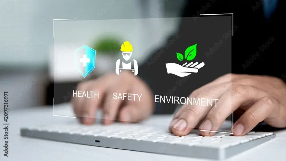 Ein Mensch tippt an einer Tastatur. Im Vordergrund sind Symbole für Gesundheit, Sicherheit und Umwelt abgebildet. Diese repräsentieren wichtige Themen in einem professionellen Kontext.