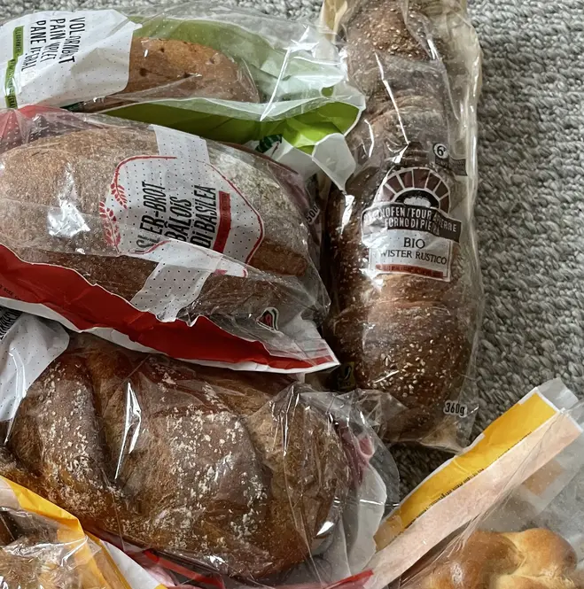 Assorted baked goods packaged in clear plastic bags