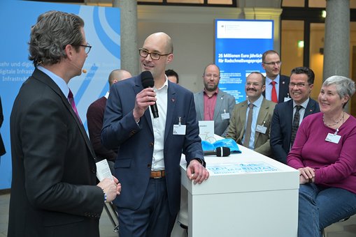 Prof. Dr. André Bruns im Gespräch mit Bundesverkehrsminister Andreas Scheuer.